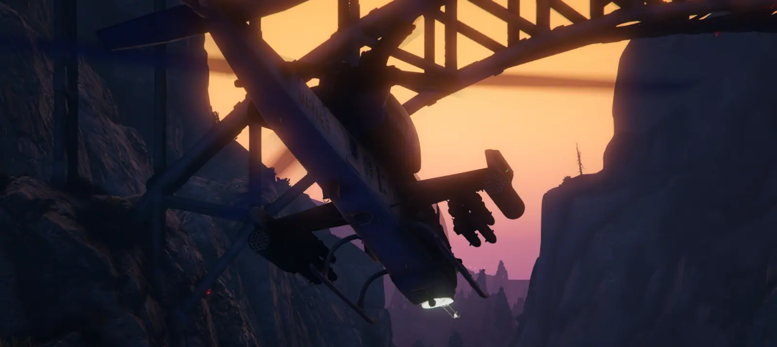 AH-1 Cobra gunship threading under a bridge span in a canyon at sunset on the MCS FiveM server