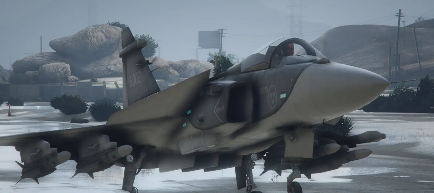 Saab JAS 39 Gripen in side profile on a wet apron with a full weapon load fitted on the MCS FiveM server