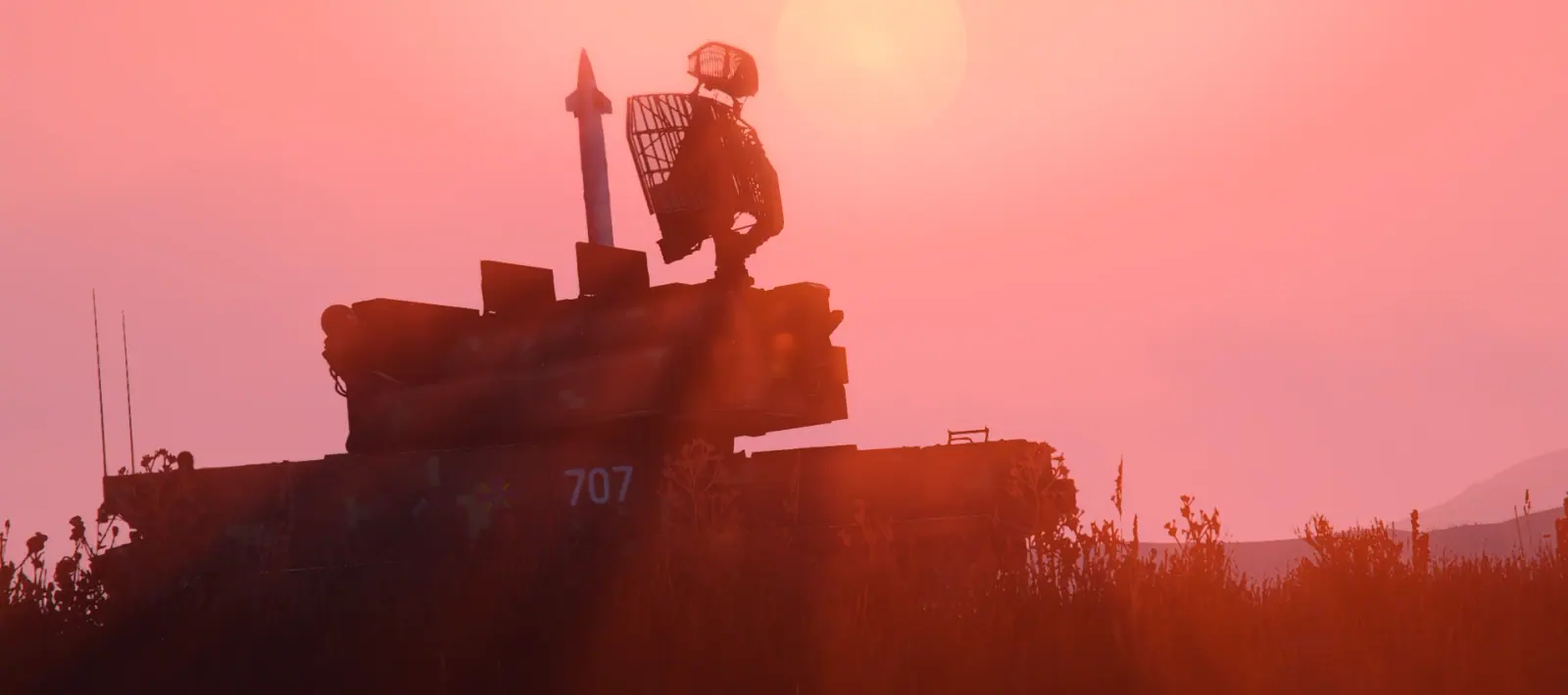 Crew standing on a tracked surface to air missile launcher in silhouette against the setting sun on the MCS FiveM server